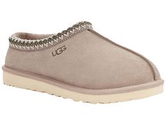 UGG Tasman - Men's Slippers : Putty : Casual, yet rugged, classic slipper. The Tasman always fits tight at first especially if someone has a high instep or high volume foot. It does stretch out over time. If you are in between sizes, please size up or down based on the volume of your foot and height of your instep. The UGG Tasman is a casual, yet rugged, classic slipper. Sheepskin laminated to cow suede adds durability to uncompromised comfort. Sheepskin laminated to cow suede adds durability to Tasman Uggs Grey, Almond Toe Slippers With Cushioned Footbed, Classic Slippers With Removable Insole And Round Toe, Classic Slip-on Slippers With Round Toe, Classic Closed Toe Slip-ons With Textured Footbed, Grey Tasman Ugg Slippers, Comfortable Almond Toe Slip-ons With Cushioned Footbed, Classic Slip-on Slippers With Textured Footbed, Cushioned Almond Toe Slip-on Slippers