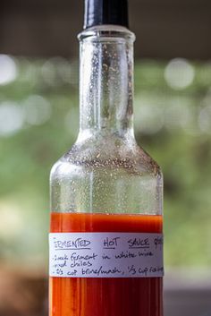 a bottle filled with liquid sitting on top of a table