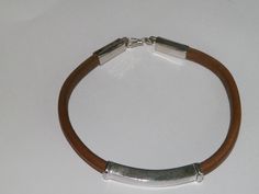 handcrafted natural leather bracelet. Manually shaped natural brown leather with silver elements and hook clasp. It's a very strong and long lasting natural leather bracelet, stamped .925 sterling silver. Length of the bracelet-Up to 22.80 cm/9 inches/ Width of the bracelet-7.79 mm/0.30inches/ Length of the silver element - 43.00 mm/1.69 inches/ Height of the silver element-6.83 mm/0.27 inches/ Length of the end caps+hook clasp-44.56mm(1.75 inches) Pick your size and color: Length: 6inches ,6,5i Leather Bracelet With Palladium Hardware As Gift, Brown Leather Bracelet With Palladium Hardware, Rectangular Silver Leather Bracelet For Everyday, Silver Rectangular Leather Bracelet For Everyday, Everyday Silver Rectangular Leather Bracelet, Silver Leather Bracelets For Everyday, Everyday Silver Leather Bracelets, Rectangular Silver Leather Jewelry, Everyday Engraved Brown Leather Bracelet