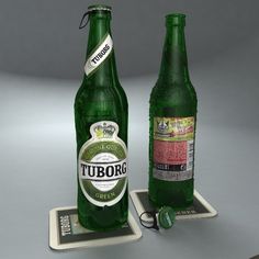 two green beer bottles sitting on coasters next to each other, one is empty