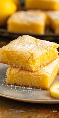 two pieces of lemon cake on a plate