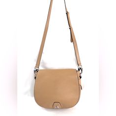 Rag & Bone!! Designer Brand Without The Designer Price. How? This Purse! This Rag & Bone Rb02956-016 Tan Pebbled Leather Small Rounded Crossbody / Shoulder Bag Has A Front Flap And Is Ready For Your Adventures. The Back Has A Magnetic Closure Pocket That Most Phones Will Fit In. On The Front, Under The Magnetic Cloruse Flap Is A Slip Pocket. The Main Section Has A Zipped Pocket. Very Good Condition. Normal Wear. Spots Around. Some Wear To Edge Trim On Top Sides Of Purse (See Last 2 Pics). This I Beige Flap Bag With Metal Hardware For Everyday Use, Classic Crossbody Saddle Bag With Silver-tone Hardware, Classic Saddle Crossbody Bag With Silver-tone Hardware, Flap Bag With Silver-tone Hardware, Beige Saddle Bag With Gold-tone Hardware, Beige Saddle Bag With Detachable Strap, Beige Satchel With Metal Hardware, Beige Leather Flap Bag With Metal Hardware, Chic Saddle Bag With Silver-tone Hardware For Travel