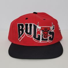 Vintage 90's Chicago Bulls Snapback Hat Red Black GCC Official Licensed NBA. New without tags. Please see photos for more details. Thank you! Red Casual Snapback Hat For Sports Events, University Red Casual Snapback Hat, Casual Red Baseball Cap For Fans, Casual University Red Snapback Hat, Red Sporty Fan Merchandise Hat, Red Sporty Hats For Fan Merchandise, Sporty Red Hat For Fan Merchandise, Red Fitted Hat For Baseball Season Streetwear, Red Sporty Hat For Sports Fans