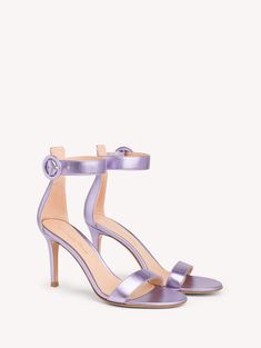 a woman's purple high heeled sandal with two straps and an ankle strap