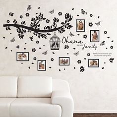 the family tree wall decal is shown with pictures and birds on it's branches