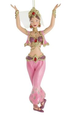 a pink ornament with a belly dancer on it's head and hands in the air