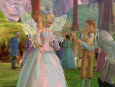 an animated image of a man and woman dressed in fairy costumes