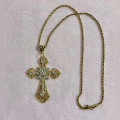 Beautiful Statement Piece, Gothic Cross Pendant Embedded With Sparkling Cubic Zirconia Gemstones On A Stainless Steel 316l Rope Chain. *Chain Length: 50cm Or 60cm.(Let Me Know Which One Would You Like (- : *Chain Material: Stainless Steel. *Cross Pendant Length:75cm *Cross Material: Zinc Alloy And Crystals. Will Ship Next Day Or Same Day If Possible. #Bigcross #Crystaljewelry #Rosarynecklace #Crossnecklace #Grungenecklace Tags: Gothic Cross Necklace Handmade Jewelry Handmade Necklace Crystal Jew Gold Cross Necklace For Party, Metal Cross Pendant Necklace With Rhinestones, Metal Rhinestone Cross Pendant Necklace, Gold Crystal Rhinestone Cross Pendant Necklace, Gothic Gold Chain Jewelry, Gothic Gold Necklace With Adjustable Chain, Gothic Gold Cross Pendant Jewelry, Coquette Rosary, Chunky Cross Necklace