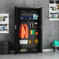 an open storage cabinet in a garage with tools and cleaning supplies on the shelf next to it