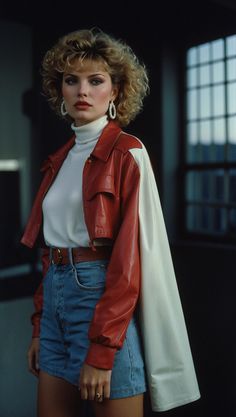 Woman wearing high-waisted jeans, a vibrant red leather jacket, and chic accessories, embodying the fashion of the 80s 80s Smart Casual, Red 80s Outfit, Colored Leather Jacket Outfit, 80s Leather Jacket Outfit, Modern Chic Outfits, Red Leather Jackets, Eighties Party, Coloured Leather Jacket