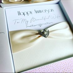 an open box with a card inside that says happy anniversary to my beautiful wife