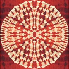 an image of a red and white tie - dye pattern in the shape of a flower