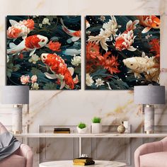 two paintings of goldfish and lily pads on a marble wall in a living room