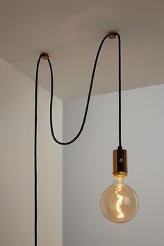 The Alamere Plug-In Pendant is the ideal swag kit lamp for any space. Easy to install, it plugs into any standard wall outlet and comes with two cord anchors to hang it anywhere. An inline dimmer on the cord allows for adjustability with any compatible dimming light bulb. Lightbulb Hanging From Ceiling, Cord Light Hanging Bedroom, Hanging Bulb Lights Bedroom, Bedside Hanging Pendant Lights, Vintage Hanging Lights In Bedroom, Modern Plug In Pendant Light, Cord Light Hanging, Pendant Plug In Light, Bedside Hanging Lamps