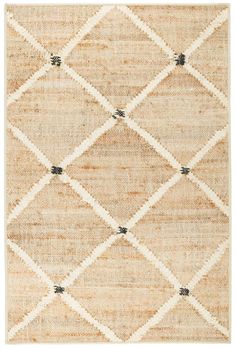 a beige and black rug with diamond shapes on the bottom, in front of a white background