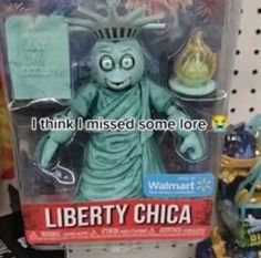 the statue of liberty doll is on display in a toy store, with caption that reads i think i missed some lore