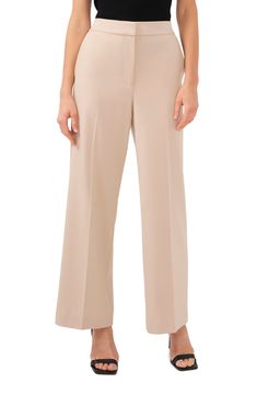 Vertical front creases elongate the legs of these polished pants designed with an elastic-back waist. 30 1/2" inseam; 22" leg opening; 12" front rise; 16 1/2" back rise (size 8) Zip fly with hook-and-bar closure Side-seam pockets Unlined 68% polyester, 28% rayon, 4% spandex Machine wash, tumble dry Imported