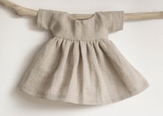 Waldorf doll dress. This high quality unbleached linen dress will look simple, but elegant at the same time. Soft and natural linen fabric. Available in 3 sizes: S --> 6-10 inch / 15-25 cm dolls M --> 10-14 inch / 25-35 cm dolls L --> 14-17 inch / 35-45 cm dolls But please check dress measurements in picture, before ordering, just to be sure, that it fits good. Also, if You need a custom size dress or You have any questions please feel free to message me. Minikane Doll, Muslin Dress, Dress Doll, Natural Linen Fabric, Cotton Poplin Fabric, Dress Linen, Custom Size Dresses, Waldorf Doll, Check Dress