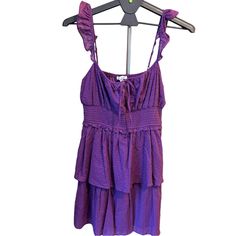 City Vibe Nwt Purple Smocked Sun Dress Size L New! Textured Swiss Dot Purple Fabric With Tired Skirt Adjustable Straps With Ruffle Detail Dress Is 100% Cotton Lining Of Skirt In 100% Polyester Measurements Included Smoke And Pet Free Home Skuo40 Sleeveless Smocked Top With Ruffle Hem For Beach, Sleeveless Smocked Top For Brunch, Smocked Mini Sundress For Vacation, Purple Ruffled Sundress For Summer, Sleeveless Smocked Top With Gathered Waist For Summer, Ruched Tiered Smocked Sundress, Casual Mini Length Smocked Sundress, Beach Smocked Dress With Ruffled Straps, Flowy Mini Sundress With Smocked Bodice