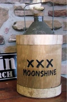 an old fashioned wooden lantern sitting on top of a table