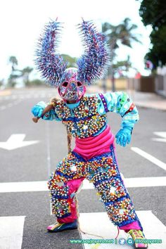 a person in costume standing on the street