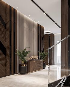 an elegant lobby with marble floors and wood paneling on the walls, along with potted plants