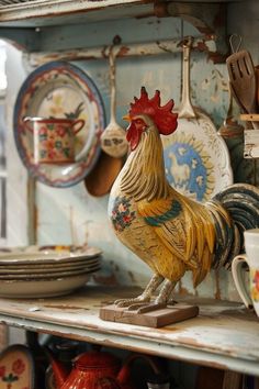 a rooster figurine sitting on top of a shelf next to plates and utensils