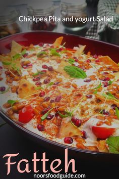 a pizza with cheese, tomatoes and other toppings in a pan on a table