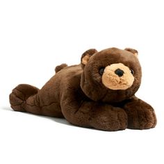 a brown stuffed animal laying on its side