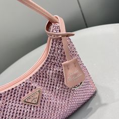 SHOP MORE LUXURY PRODUCTS HERE Description Prada Satin Mini-Bag With Crystals Silver For Women, Women’s Bags 8.6in/22cm This mini hobo bag, an iconic Prada style, comes in a luxurious satin version studded with crystals and decorated with the emblematic enamel triangle logo. Size: 22 x 17 x 6 cm /8.6 x 6.7 x 2.3 inches (Length x Width x Height) SilverAll-over synthetic crystalsZipper closureEnameled metal triangle logoSilk satin lining Includes box, dust bag.This product is of the premium Mini Hobo Bag, Prada Style, Louis Vuitton Shirt, Chanel Shirt, Triangle Bag, Triangle Logo, Small Handbags, Green Bag, Black Handbags