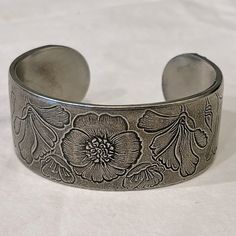 Salisbury Pewter Month Of August Wrist Cuff Bracelet. Easily Bends To Put On And Take Off And Accommodates Wrists Small And Large. Detailed With Beautiful Flowers. Diameter 2.5”, 1”W Condition: Never Worn. New Condition. August Month, Pewter Jewelry, Month Of August, Wrist Cuffs, Trombone, Salisbury, Womens Jewelry Bracelets, Put On, Cuff Bracelet