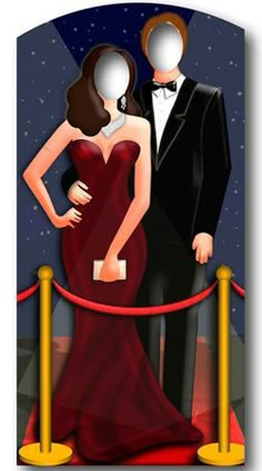 a man and woman in formal wear standing on a red carpet