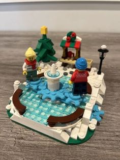 a lego christmas scene is shown on the table