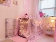 a baby's room is decorated in pink and white