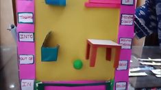 this is an image of a pink and yellow door with furniture on the outside wall