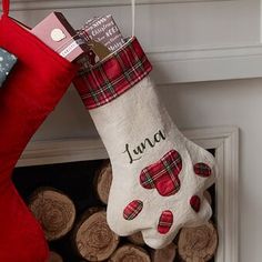 a christmas stocking hanging from the fireplace