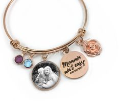 "This rose gold stainless steel wire bangle bracelet comes with an engraved charm that says \"Mommin' ain't easy #worthit\" as well as a 2nd charm that will feature your photo - and to top it off, a rose charm and birthstone for each of your kids! Choose 1 to 6 birthstones. Terrific gift for your mom for Mother's Day or Birthday. TO SEND PHOTO After ordering, please send us an Etsy convo and attach your photo. Or, you can email your photo to littlegemgirl@hotmail.com. If you email your photo, pl Wire Bangle Bracelets, Rose Gold Charms, Wire Bangles, Photo Charms, Photo Necklace, Gold Charm Bracelet, Gifts For Your Mom, Stainless Steel Wire, Birthstone Charms