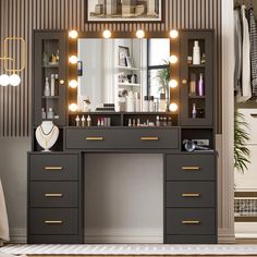 a dressing table with lights on it in front of a mirror and shelves filled with personal items