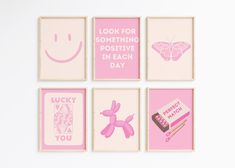 four pink and white wall art pieces with different sayings on the same piece, including a smiley face