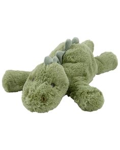 a green stuffed alligator laying on its side