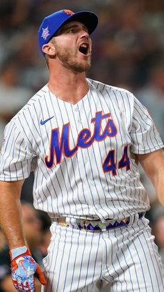 a baseball player with his mouth wide open