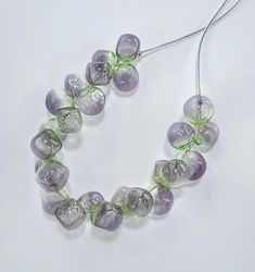 All products are handmade and unique. All beads are made by myself, in my own studio in Turkey-Selçuk-Şirince village. For my work i used Effetre (Moretti) - İtalian glass and the others. Shaped with breath.  Stainless steel wire, transparent silicone cord and nickel free clasp.  About 50 cm  long. If it falls on a hard surface, it may break. Do not wash with water. Wipe gently with a damp, soft cloth. The necklace is in an asymmetrical form.  The form does not deteriorate when you remove the br Recycled Glass Beaded Necklaces As Gifts, Recycled Glass Beaded Necklace With Round Beads As Gift, Recycled Glass Beaded Necklaces For Gifts, Recycled Glass Beaded Necklaces With Round Beads As Gift, Unique Recycled Glass Large Bead Necklaces, Unique Necklaces With Large Recycled Glass Beads, Unique Murano Glass Beaded Necklaces, Unique Murano Glass Necklaces With Large Beads, Unique Murano Glass Necklace With Large Beads