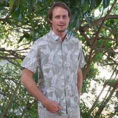 Pure Cotton Olive green with white leaf print Wash in cold or warm water preferred in gentle cycle. Best to turn shirt inside out for wash to retain color, then tumble dry or line dry. Khaki Short Sleeve Vacation Shirt, Khaki Short Sleeve Shirt For Vacation, Summer Olive Cotton Shirt, Olive Cotton Summer Shirt, Casual Camp Shirt With Palm Tree Print, Summer Outdoor Khaki Short Sleeve Shirt, Summer Khaki Short Sleeve Shirt For Outdoor, Khaki Short Sleeve Shirt For Summer Outdoor, Green Short Sleeve Shirt With Palm Tree Print