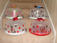 three cakes sitting on top of a set of stairs with bows and polka dot designs