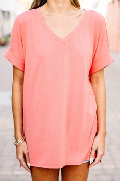 This versatile v-neck tee is here to make your life easy! It's honestly the perfect top for year round styling and layering. You can knot the hem or half tuck into your favorite jeans or shorts. You can layer it with all sorts of jackets, shackets, or kimonos. And don't even get us started on accessories! The options are absolutely endless! This top is truly a staple piece! This top features a v neckline, short cuffed sleeves, and a generous fit.Material has generous amount of stretch. Sydney is Spring Everyday V-neck Top, Versatile V-neck T-shirt For Loungewear, Casual Short Sleeve V-neck Top For Day Out, Casual V-neck Top For Layering With Relaxed Fit, Casual V-neck Top With Relaxed Fit For Layering, Versatile Summer T-shirt, Casual Cotton V-neck Top For Spring, Summer Cotton V-neck T-shirt, Summer Cotton T-shirt With V-neck