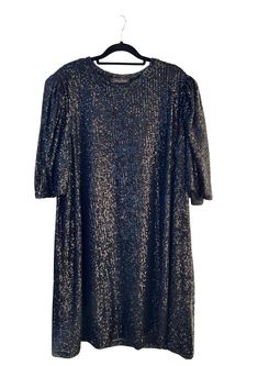 Get ready to shine in the ANNIE SEQUIN T-SHIRT DRESS! This versatile dress is perfect for any special occasion, with shimmering sequins that catch the light and add a touch of luxury to your wardrobe. You'll love the comfortable, glamorous, and effortless style of the ANNIE SEQUIN T-SHIRT DRESS! 🖤 this model who is a size S is photographed in a size L for extra movement. If you want that please size up 1-2 sizes. Choose your desired size for a shift-like fit (with room for movement) like how Da Sequin Shirt Dress Night Out, Sequin Tshirt Dress, Eras Tour Midnights T Shirt Dress, Black Sequin Tshirt Dress, Sequin T Shirt Dress, Black Sequin Short Sleeve T-shirt, Oversized T Shirt Dress, Versatile Dresses, Sequin Dress