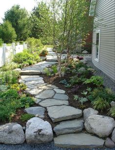 a stone path in front of a house