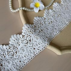 white lace with flowers and pearls on the table