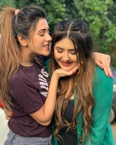 two young women standing next to each other