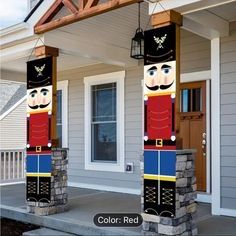 two large wooden nutcrackers are on the front porch